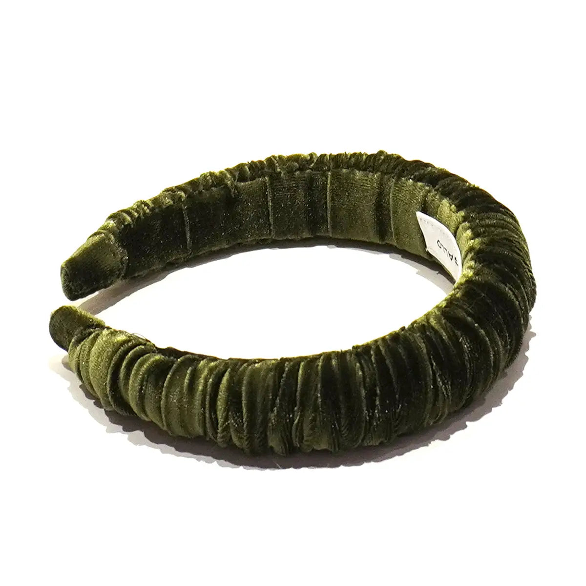Cerchietto goffrato in ciniglia verde.