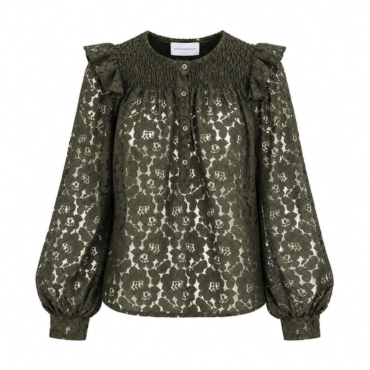 ARYA, camicia in pizzo verde con rouches sulle spalle e maniche a palloncino.