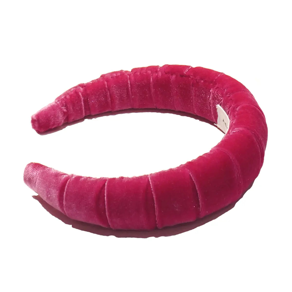 Cerchietto goffrato in ciniglia fucsia.