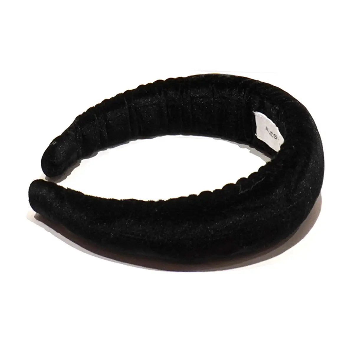 Cerchietto liscio in ciniglia nera.